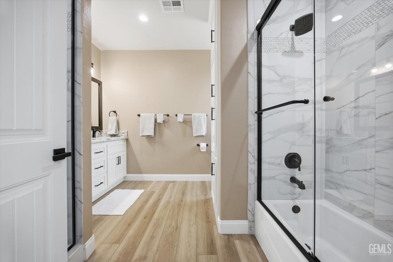 Undisclosed Address Tehachapi, CA 93561 - Photo 31 of 47 a bathroom with a glass shower door and a sink