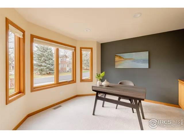a living room with a table and a window