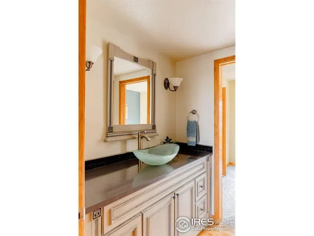 a view of a living room area with wooden floor