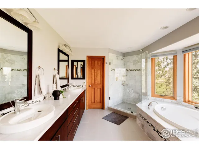a bathroom with a bathtub and a window