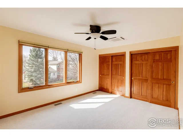 a bathroom with a granite countertop sink mirror toilet and bathtub