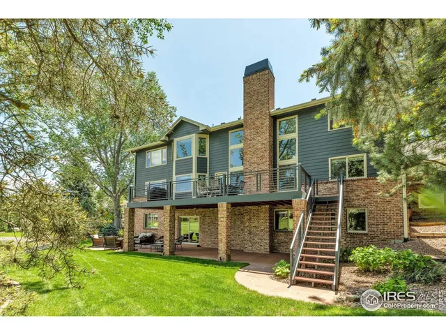 a view of a chairs and table on the wooden deck