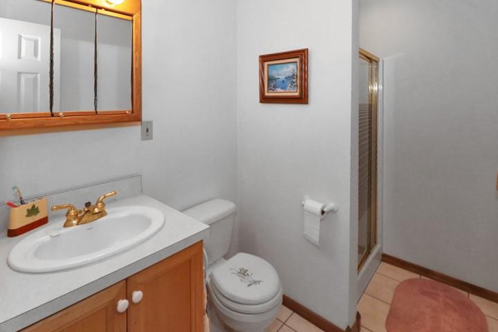 22441 Rockdale Road Cambridge Springs, PA 16403 - Photo 11 of 22 a bathroom with a sink toilet and vanity