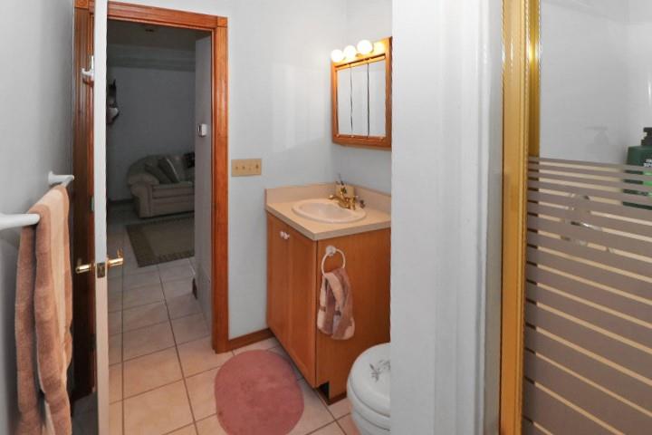 22441 Rockdale Road Cambridge Springs, PA 16403 - Photo 12 of 22 a bathroom with a toilet a sink and mirror