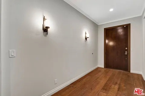 a view of empty room with window and closet