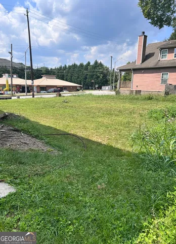 a view of a house with a big yard
