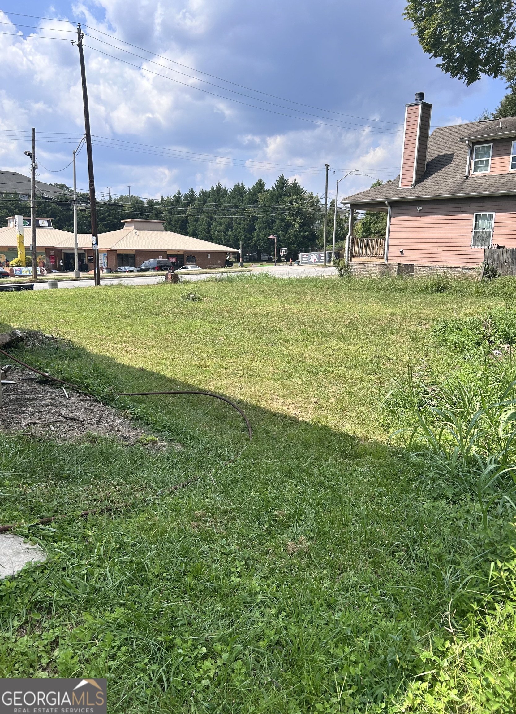 a view of a house with a big yard