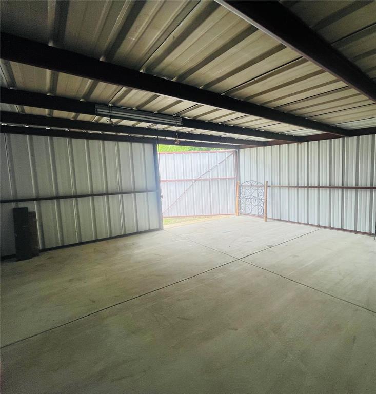 111 Rousseau Street Waxahachie, TX 75165 - Photo 19 of 22 a view of an empty garage