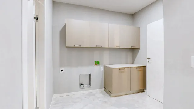 a view of a hallway with wooden floor and entryway