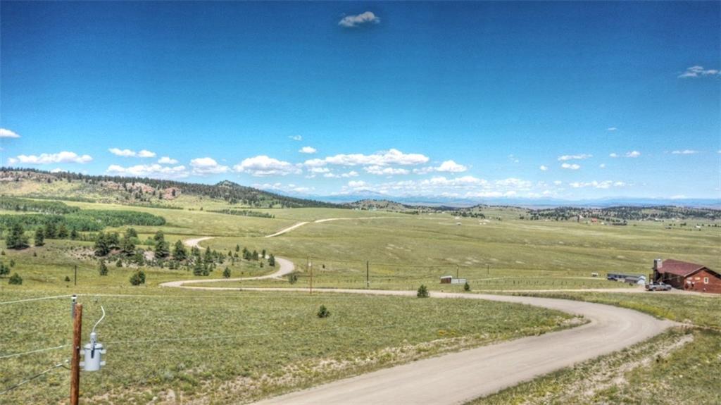 7209 Ranch Road Hartsel, CO 80449 - Photo 4 of 27 a view of a lake and a mountain