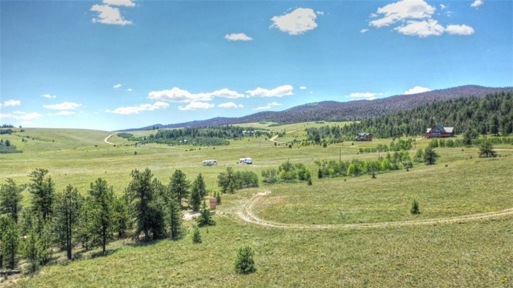 7209 Ranch Road Hartsel, CO 80449 - Photo 6 of 27 a view of a lake with a mountain
