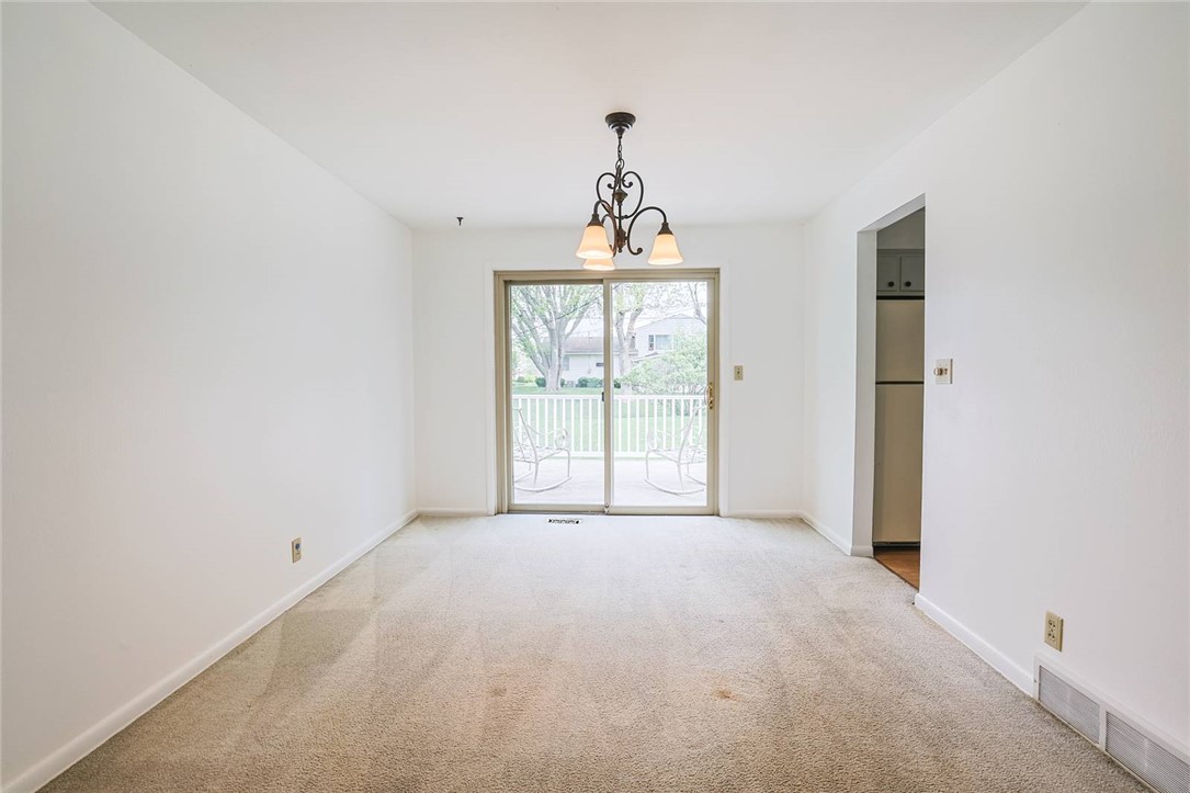 452 Cookston Avenue Springfield, OH 45503 - Photo 8 of 34 This versatile room offers bright interiors and access to a charming patio, perfect for daily living.