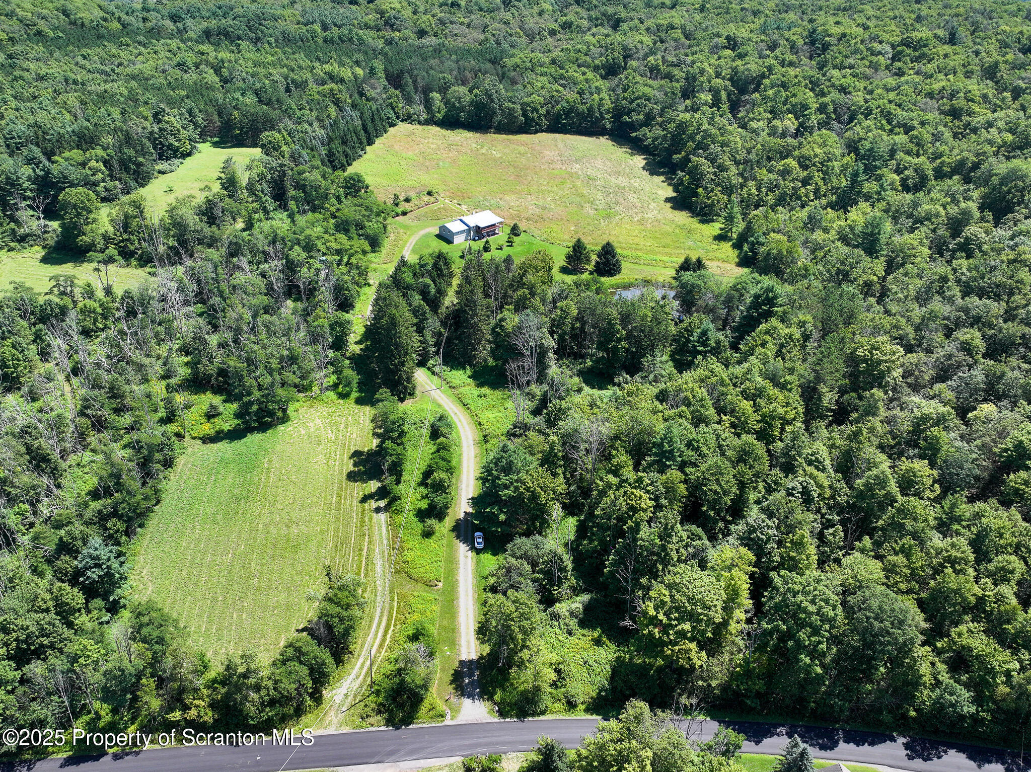5290 Irish Hill Road Montrose, PA 18801 - Photo 11 of 67 an aerial view of a house with a yard