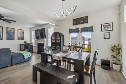 a living room with lots of furniture and clutter