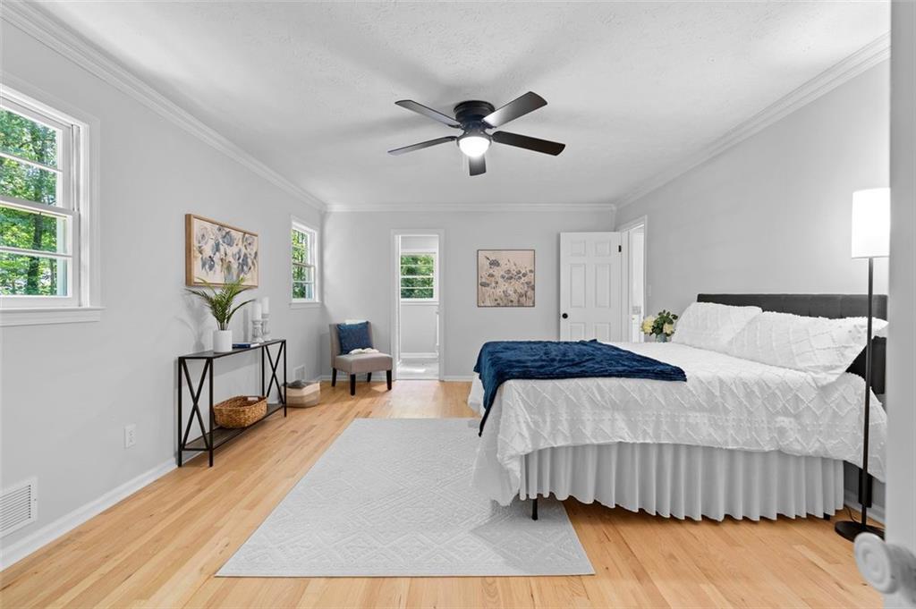2984 East Paulding Drive Dallas, GA 30157 - Photo 19 of 35 a bedroom with a bed and wooden floor