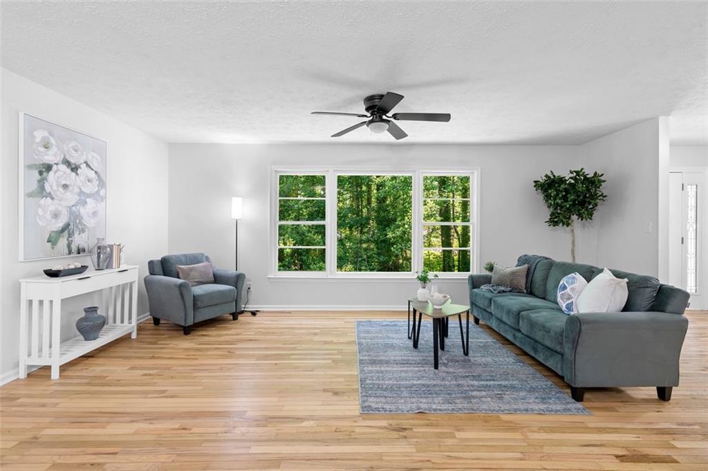 2984 East Paulding Drive Dallas, GA 30157 - Photo 29 of 35 a living room with furniture and a large window
