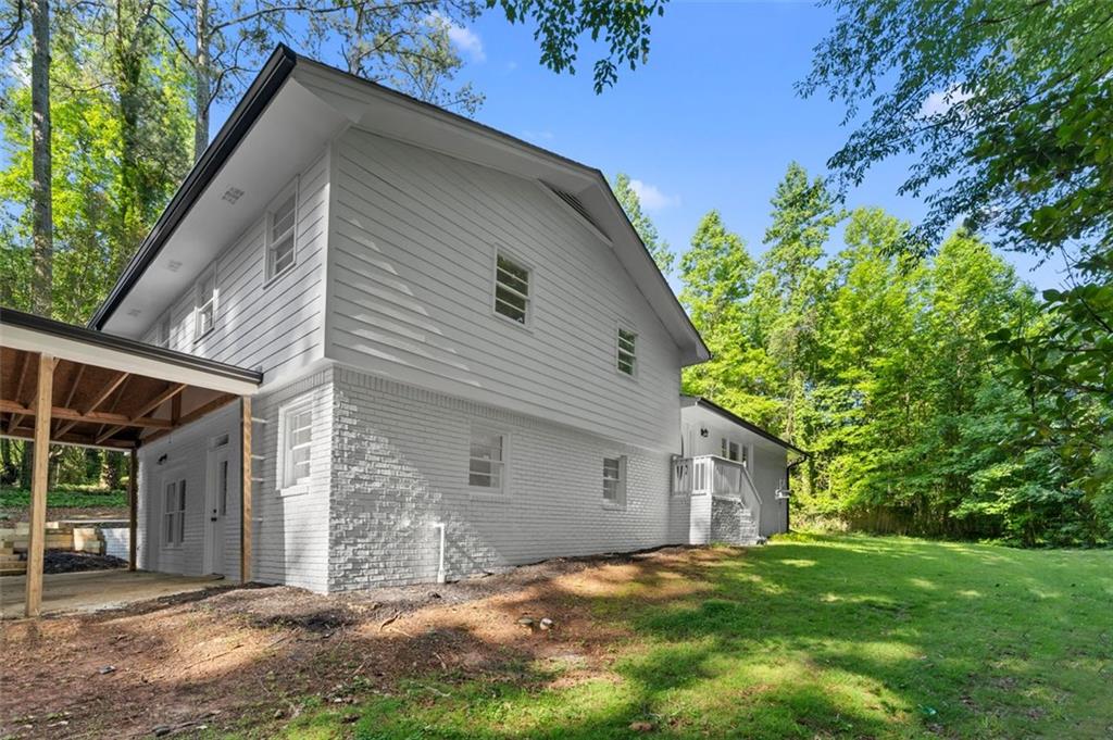 2984 East Paulding Drive Dallas, GA 30157 - Photo 33 of 35 a view of a house with a yard