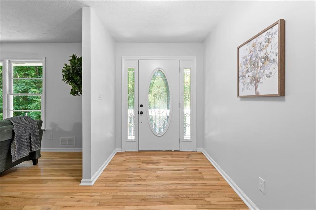 2984 East Paulding Drive Dallas, GA 30157 - Photo 34 of 35 a view of a hallway with wooden floor and door