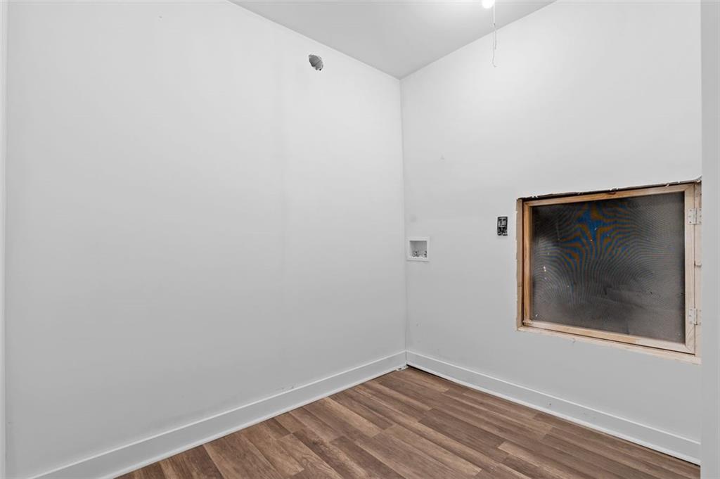 2984 East Paulding Drive Dallas, GA 30157 - Photo 5 of 35 a view of a small space with wooden floor and a window