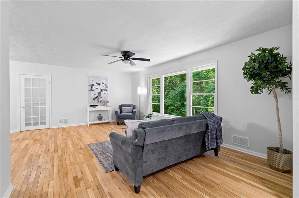 2984 East Paulding Drive Dallas, GA 30157 - Photo 7 of 35 a living room with furniture and a large window