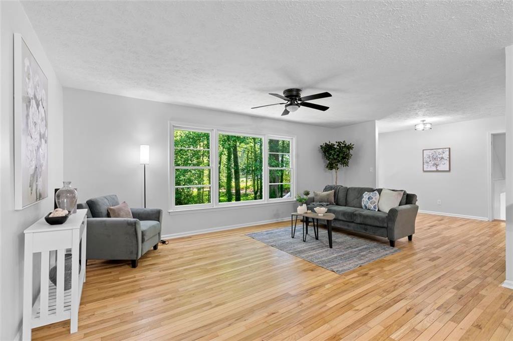 2984 East Paulding Drive Dallas, GA 30157 - Photo 8 of 35 a living room with furniture and a large window