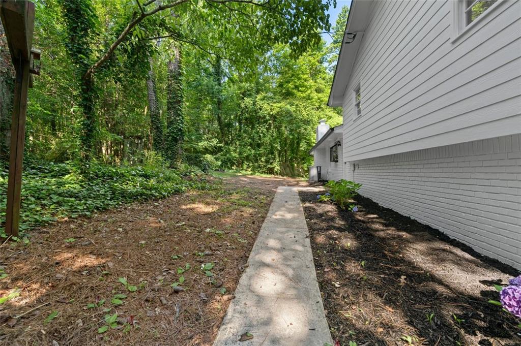 2984 East Paulding Drive Dallas, GA 30157 - Photo 9 of 35 a backyard of a house with lots of green space