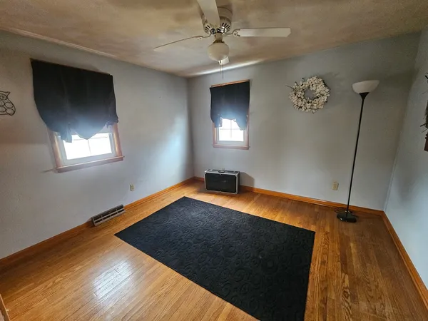 a room with window and wooden floor