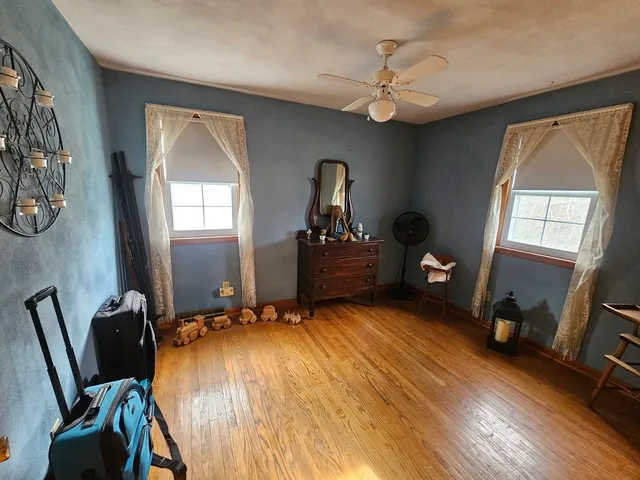 a bedroom with bed and window