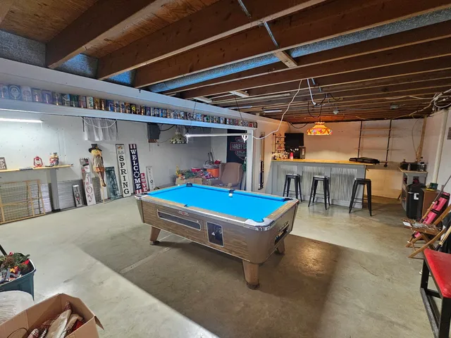 a room with lots of furniture and a chandelier