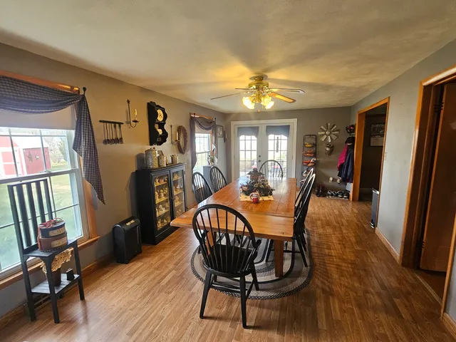 a view of a dining room with furniture window and wooden floor