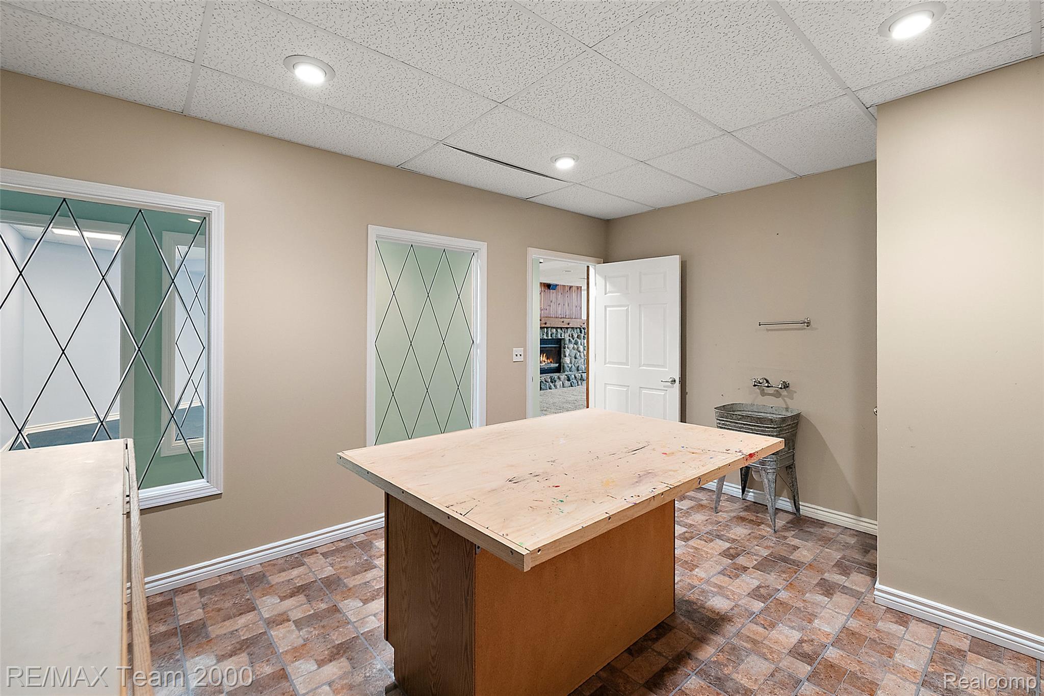 630 Sheldon Court Rochester, MI 48306 - Photo 83 of 94 Office featuring a paneled ceiling and brick patterned floors