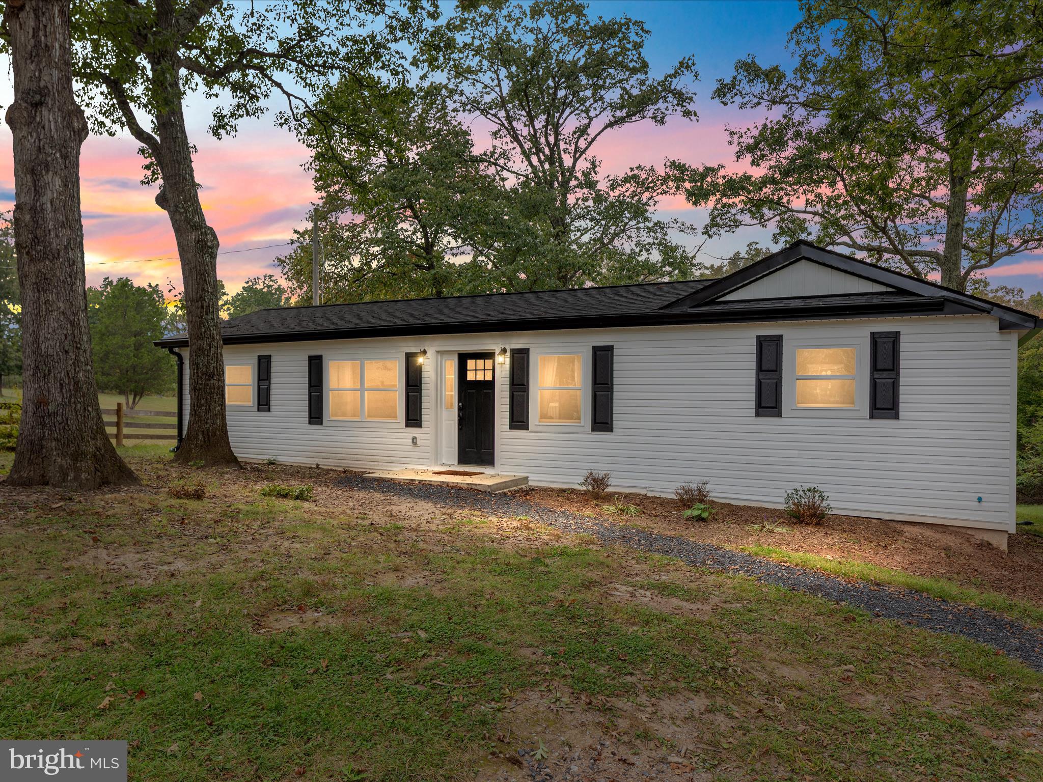 a backyard of a house with lots of green space