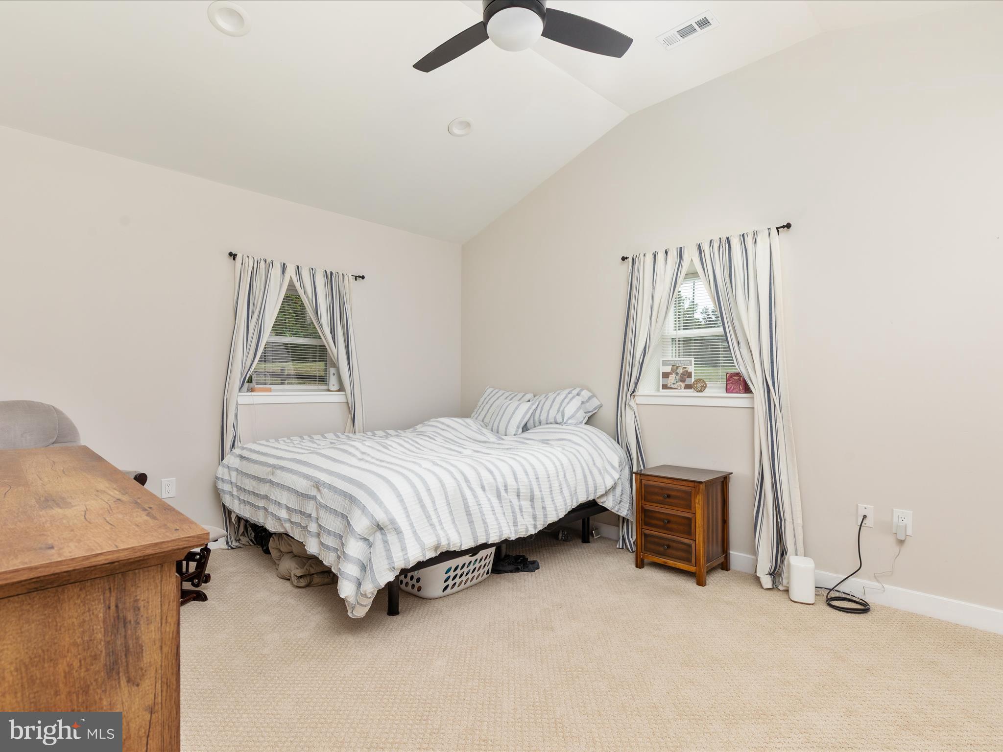790 McDonald Road Winchester, VA 22602 - Photo 11 of 36 a bedroom with a bed and a chandelier