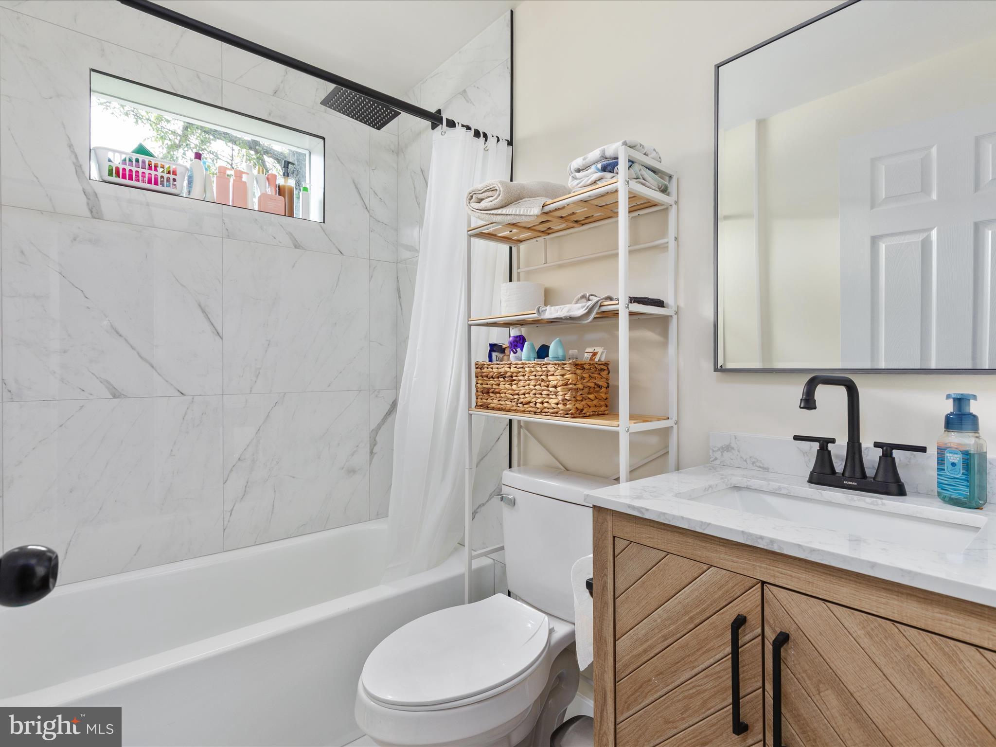 790 McDonald Road Winchester, VA 22602 - Photo 16 of 36 a bathroom with a sink a toilet and shower