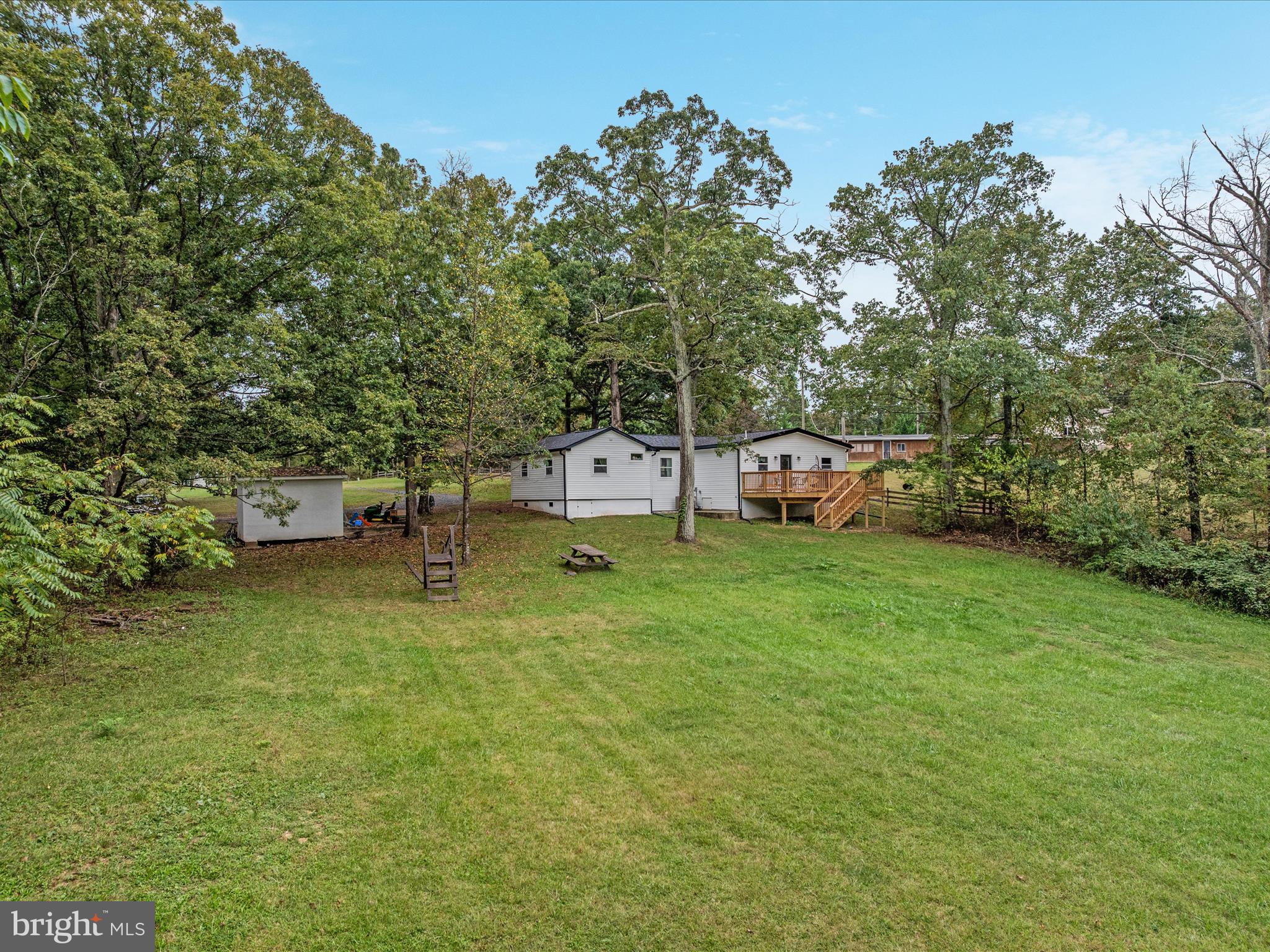 790 McDonald Road Winchester, VA 22602 - Photo 22 of 36 a backyard of a house with table and chairs