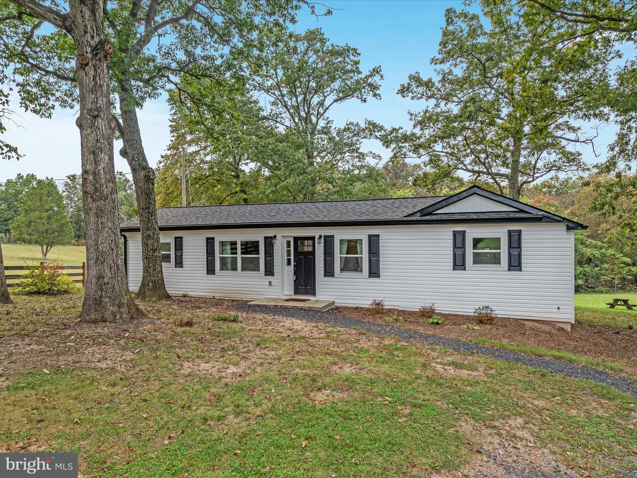 790 McDonald Road Winchester, VA 22602 - Photo 25 of 36 a view of house with yard and trees in the background