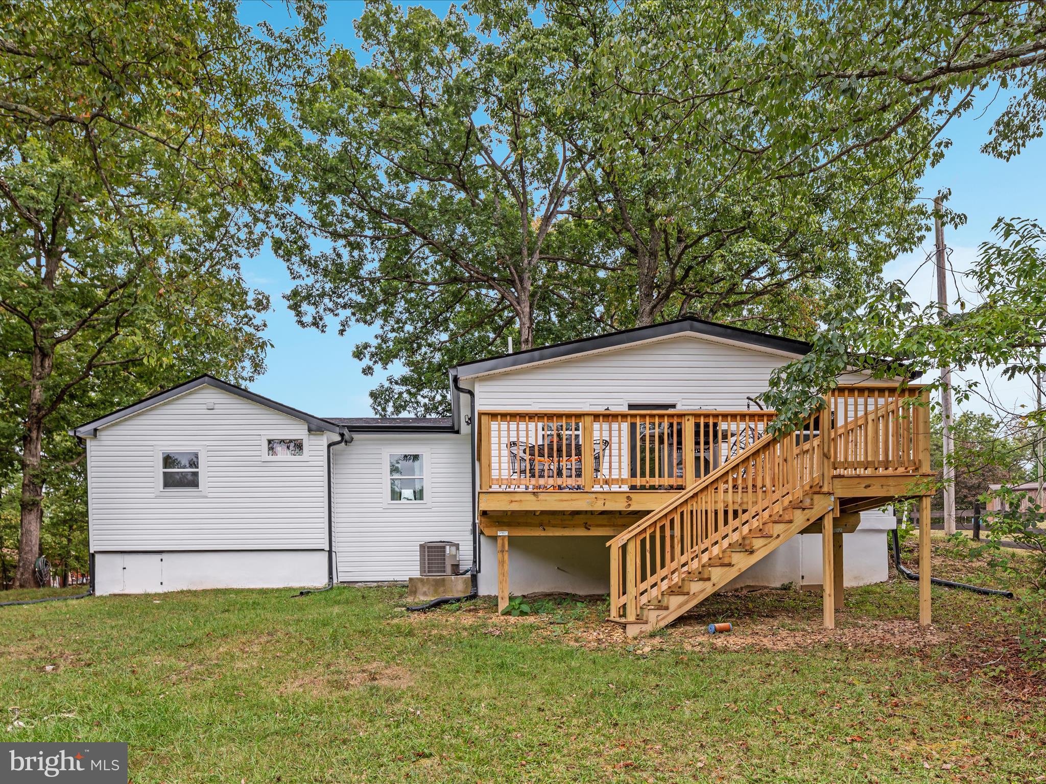 790 McDonald Road Winchester, VA 22602 - Photo 28 of 36 a house view with a garden and deck
