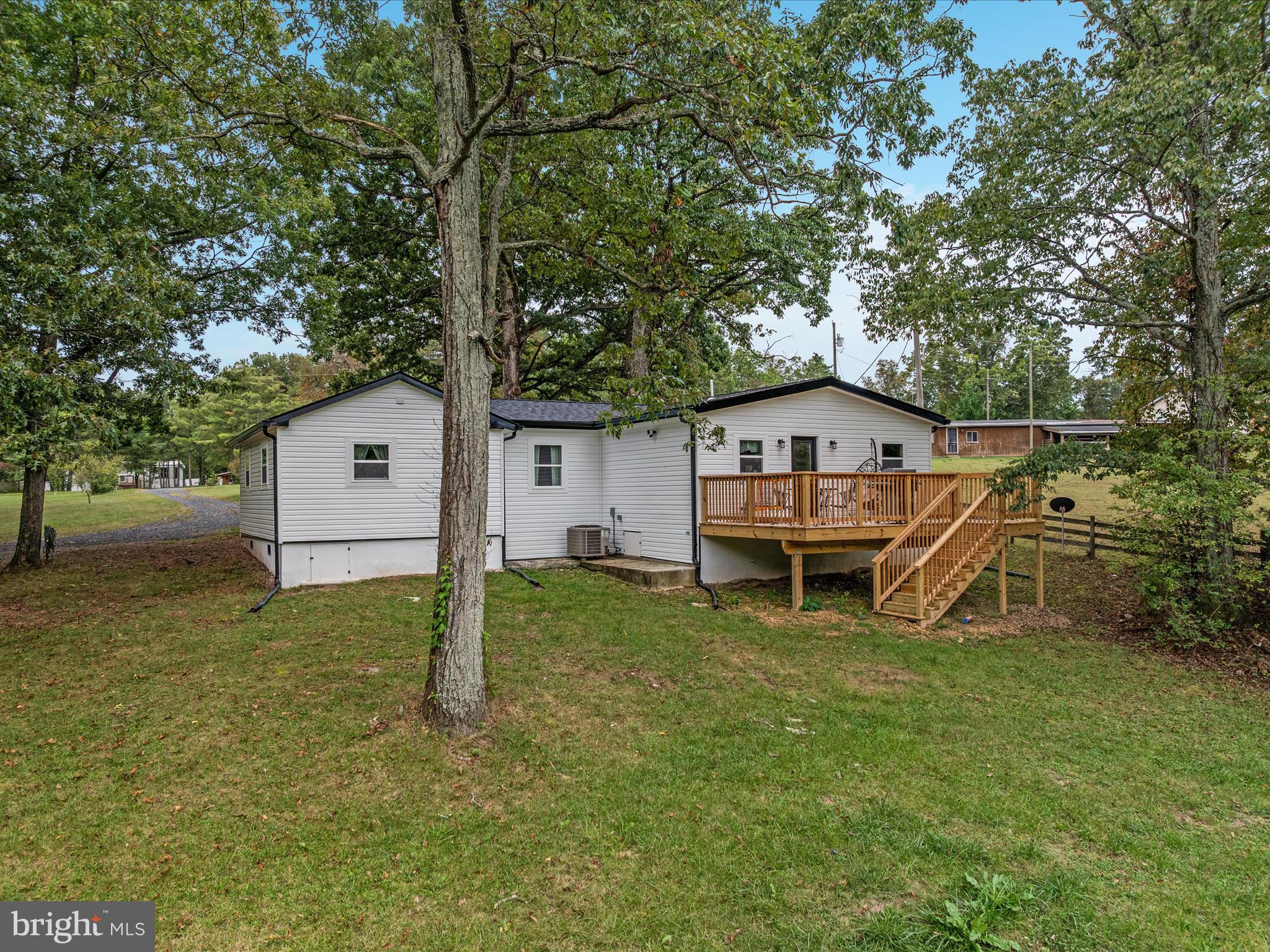 790 McDonald Road Winchester, VA 22602 - Photo 29 of 36 a house with trees in the background