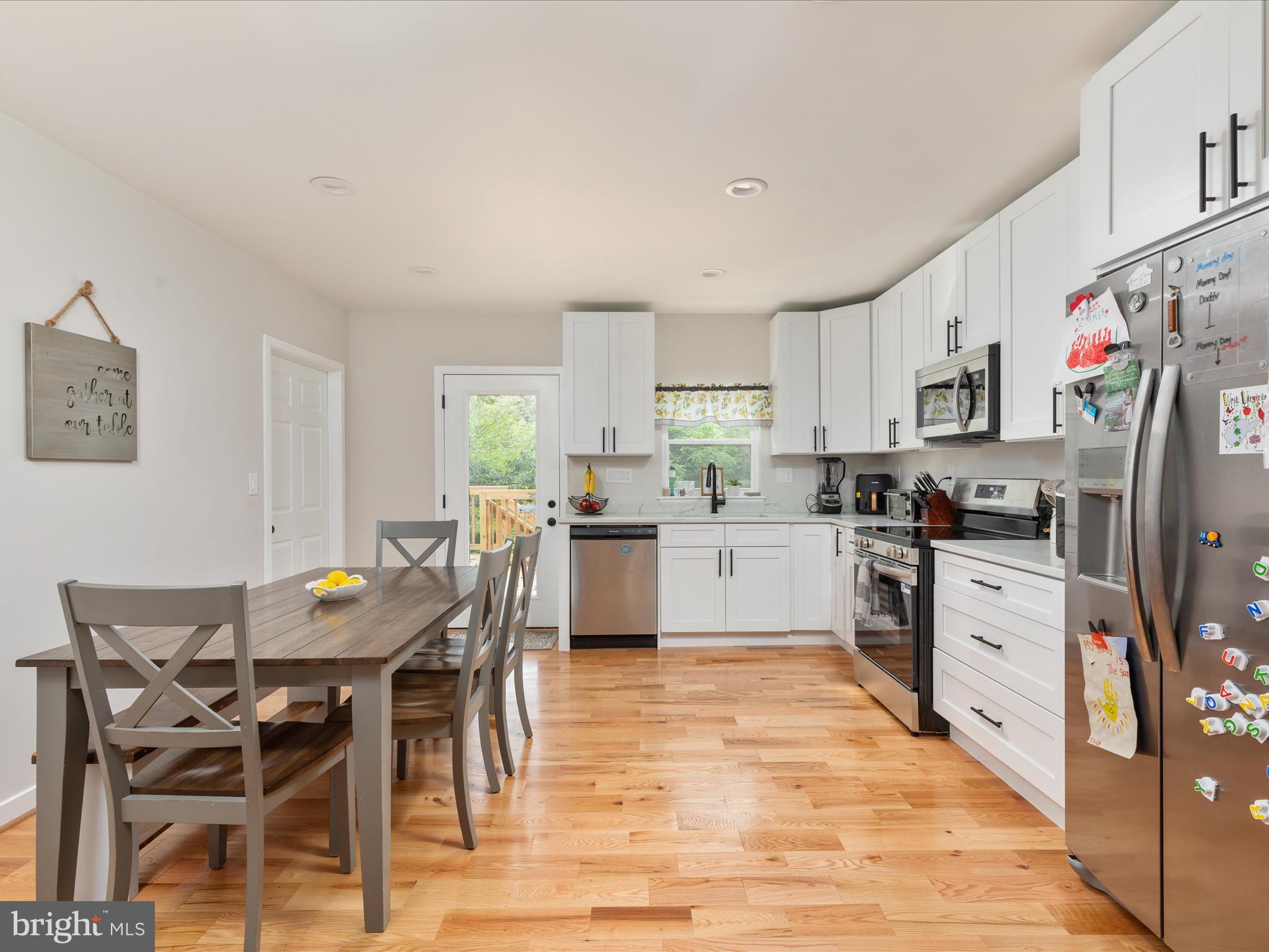790 McDonald Road Winchester, VA 22602 - Photo 3 of 36 a kitchen with granite countertop stainless steel appliances white cabinets and refrigerator