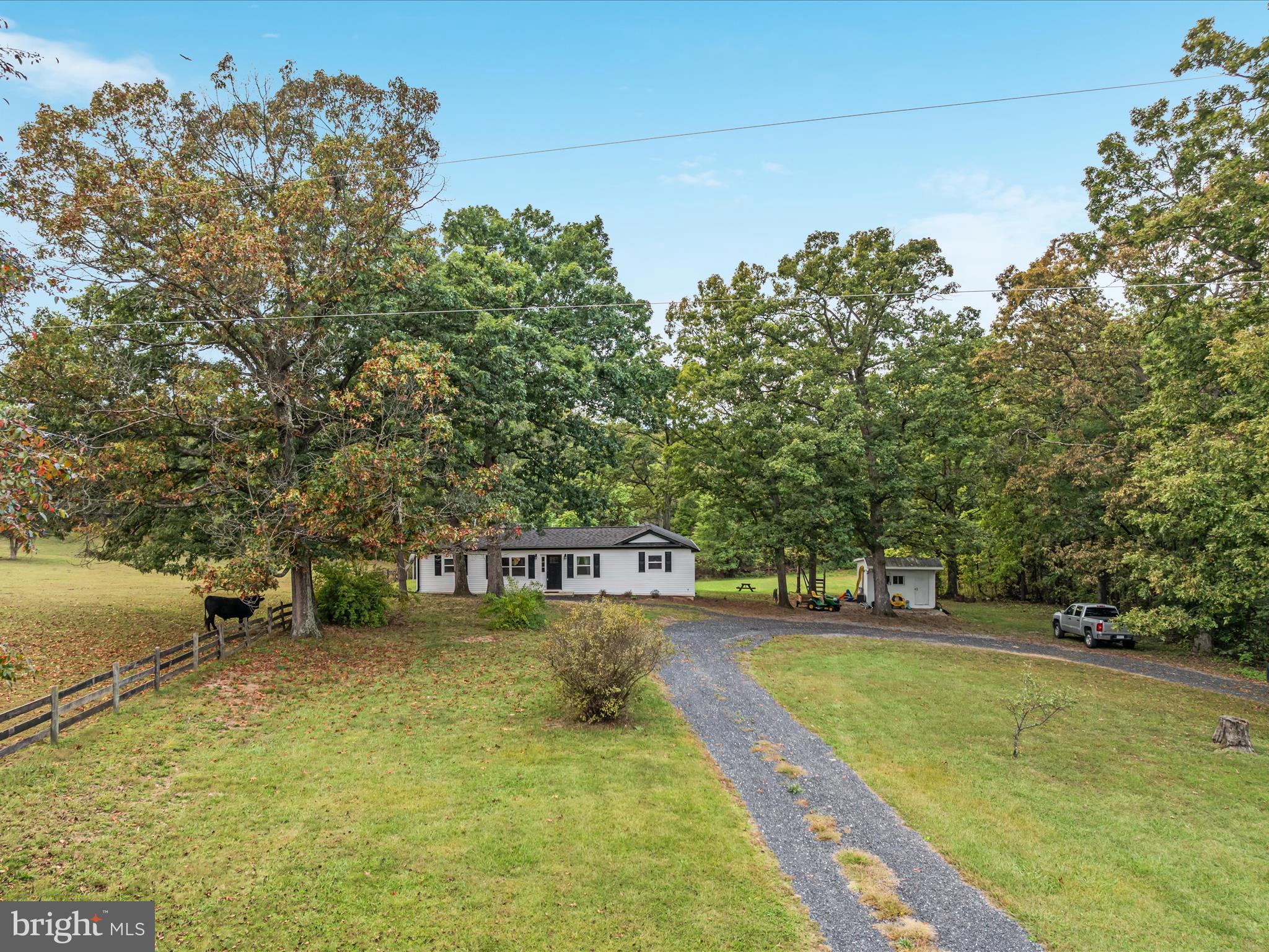 790 McDonald Road Winchester, VA 22602 - Photo 31 of 36 a view of a swimming pool with an outdoor seating and a yard