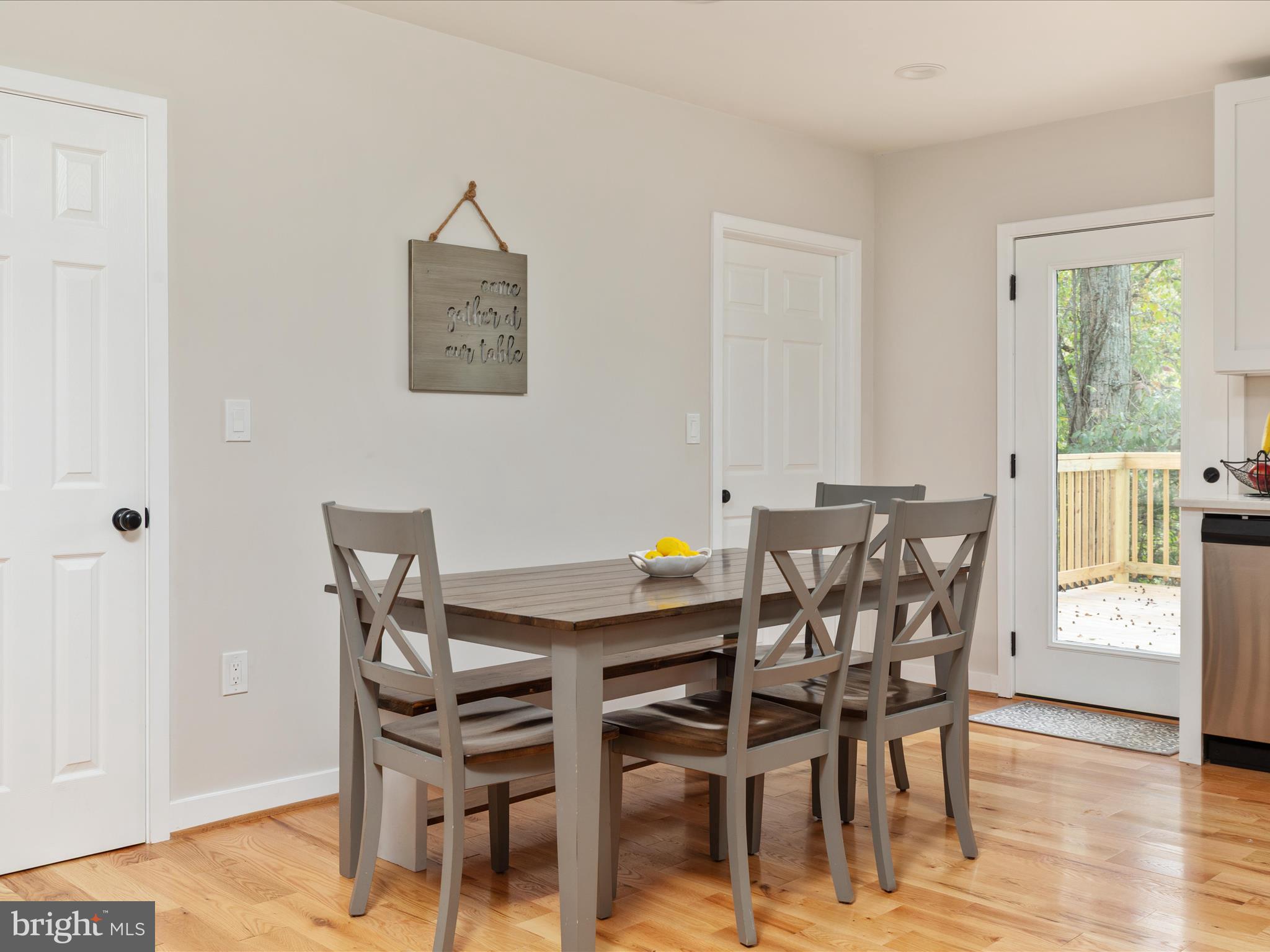 790 McDonald Road Winchester, VA 22602 - Photo 5 of 36 a view of a dining room with furniture and wooden floor