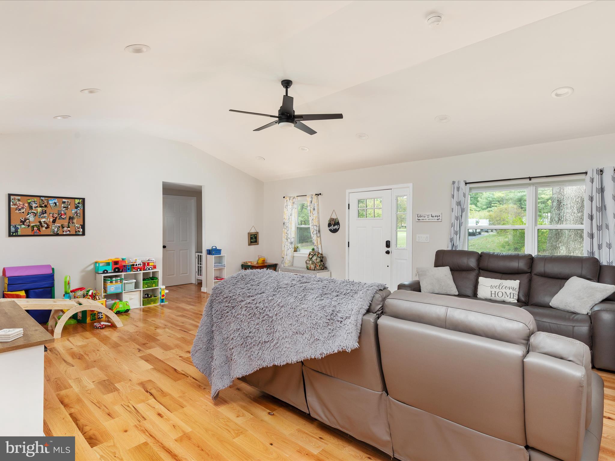 790 McDonald Road Winchester, VA 22602 - Photo 7 of 36 a living room with furniture and a wooden floor