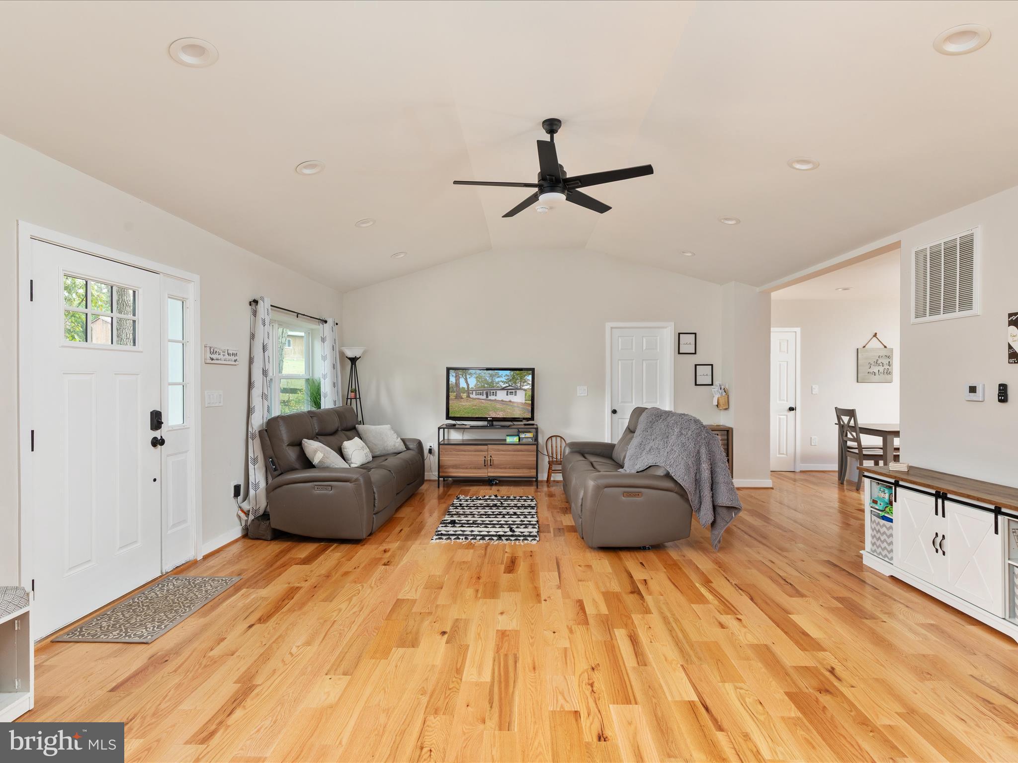 790 McDonald Road Winchester, VA 22602 - Photo 8 of 36 a living room with furniture and a wooden floor