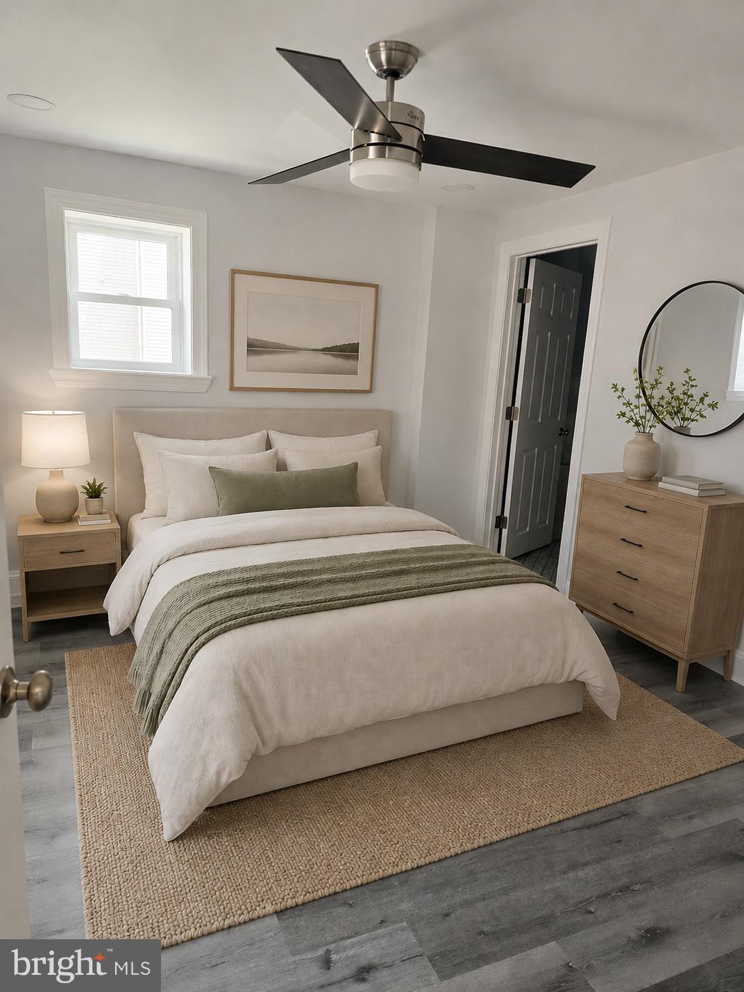 5925 Ridge Avenue, Unit 5 Philadelphia, PA 19128 - Photo 8 of 31 a bedroom with a bed and a chandelier