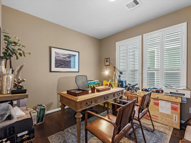 a work room with furniture and windows