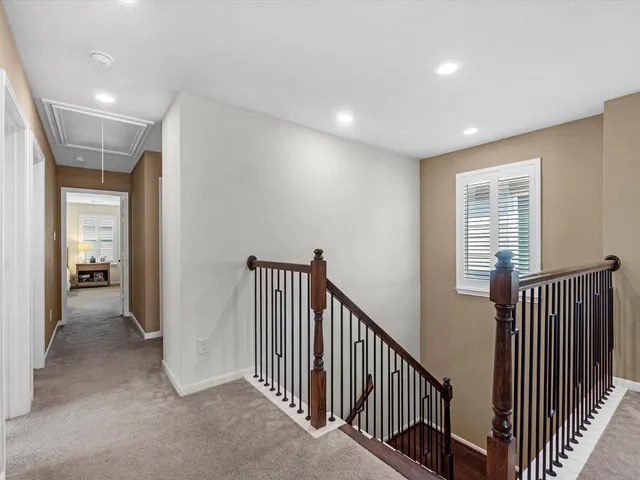 a view of a hallway with windows