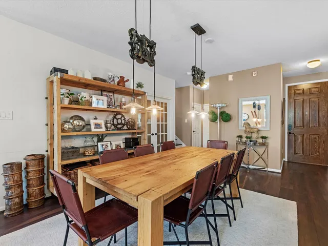 a dining room with a table and chairs