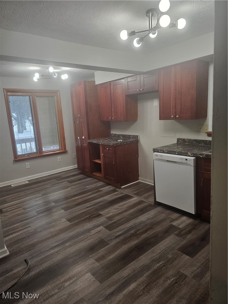 4495 Ammon Road Cleveland, OH 44143 - Photo 7 of 26 Kitchen with dishwashing machine, a textured ceiling, dark wood finished floors, and dark stone counters