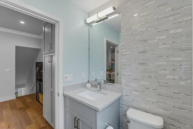 a bedroom with window and a dresser