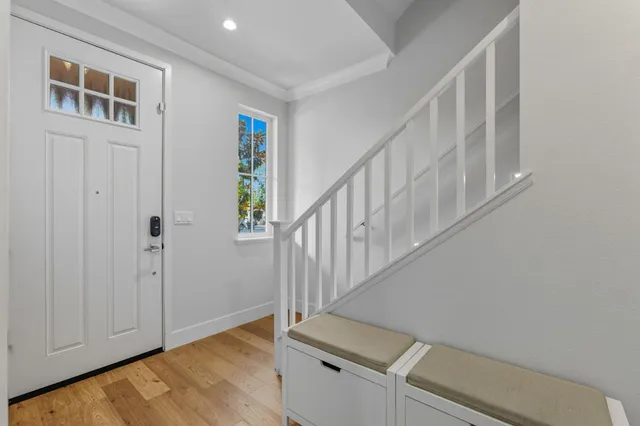 an empty room with a window and a dresser